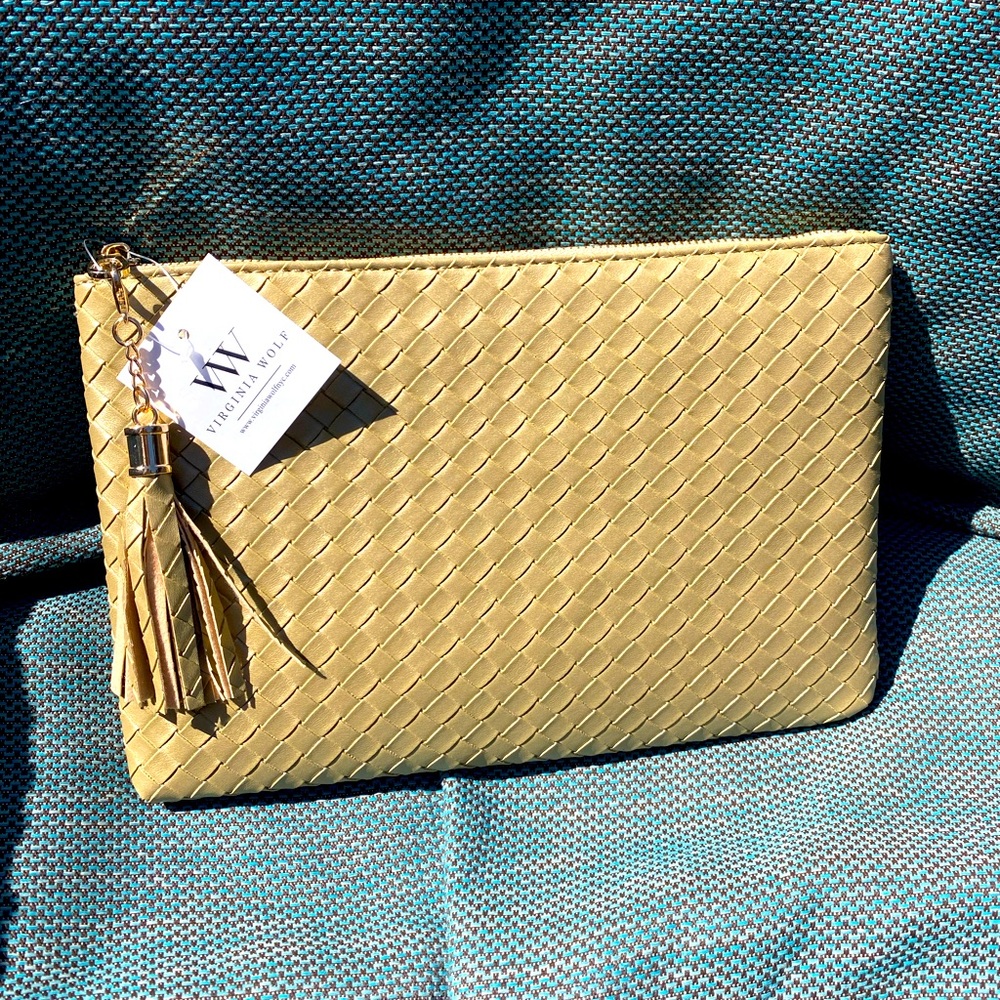 NWT. Virginia Wolfe NYC metallic gold woven leather clutch with tassle.